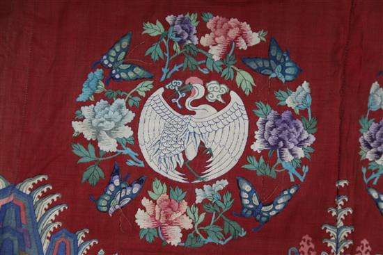 A Chinese Kesi red ground crane medallion table frontal, late Qing dynasty, 102 x 157cm